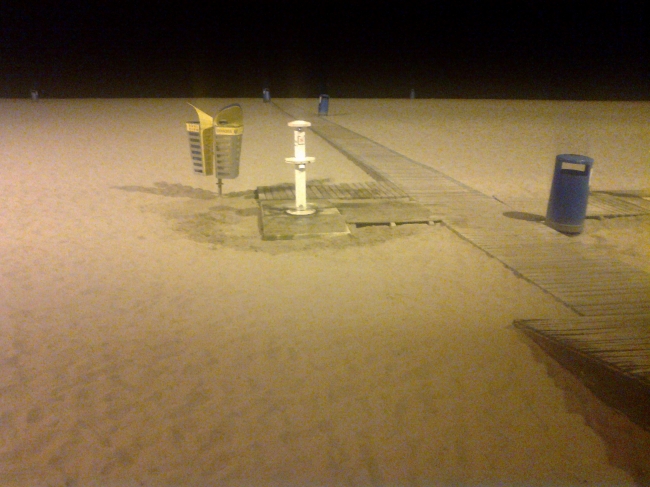 Wooden catwalk and the black sea at night, 