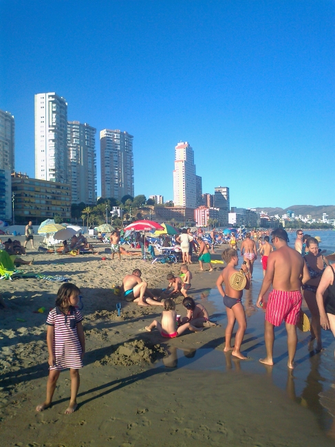 People at the beach in Poniente, looking towards balcon de poniente
