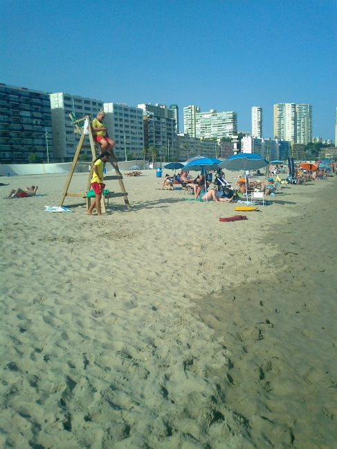 Life guard on duty, in contrast to the popular red Baywatch buoys, the Spanish guards use yellow ones