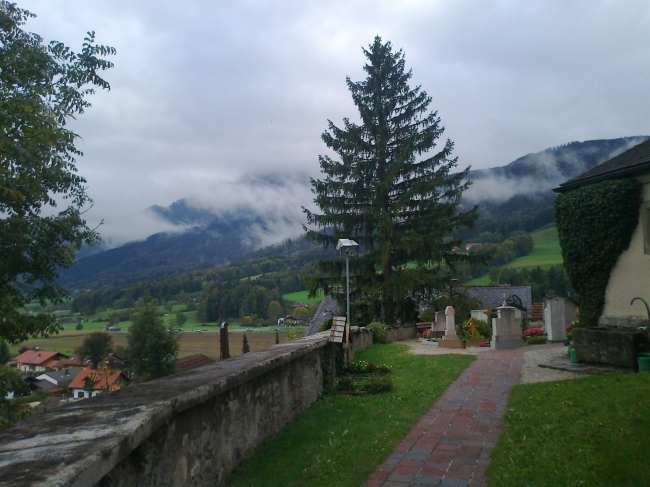 Clouds over the mountains, graveyard in front, 