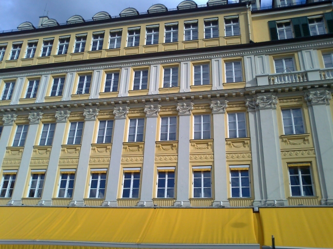 The bright yellow facade of Alois Dallmayr headquearters in Munich, 
