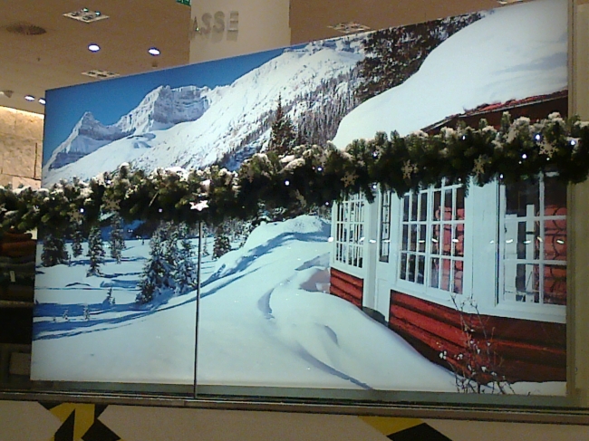 Winter decoration at P&C, a snowy landscape as a giant mural near the escalators in Peek & Cloppenburg, Düsseldorf