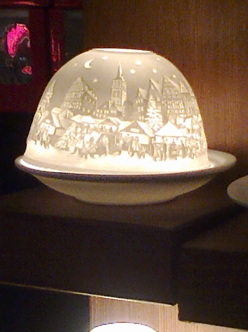 Porcelain winter scenery, found on the Christmas market, back-lit, obviously