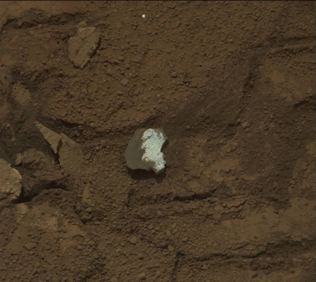 Rock "Tintina" Exposes "Yellowknife Bay" Vein Material, This raw image of "Tintina," a broken rock fragment in a rover wheel track, was taken by Curiosity's Mast Camera (Mastcam). When Curiosity drove over Tintina...