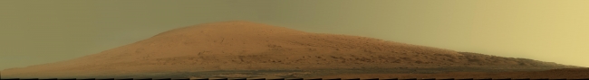 Mount Sharp Panorama in Raw Colors, This mosaic of images from the Mast Camera (Mastcam) on NASA's Mars rover Curiosity shows Mount Sharp in raw color as recorded by the camera. Raw color shows...