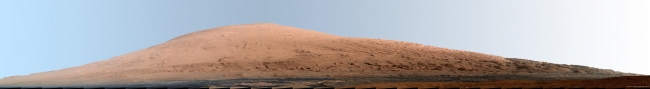 Mount Sharp Panorama in White-Balanced Colors, This mosaic of images from the Mast Camera (Mastcam) on NASA's Mars rover Curiosity shows Mount Sharp in a white-balanced color adjustment that makes the sky...