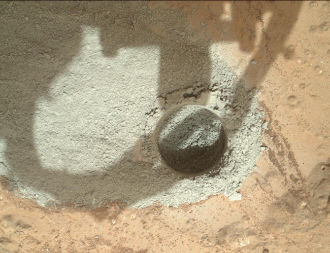 Preparatory Test of Drilling on Mars Generates Rock Powder, In an activity called the "mini drill test," NASA's Mars rover Curiosity used its drill to generate this ring of powdered rock for inspection in advance of t...