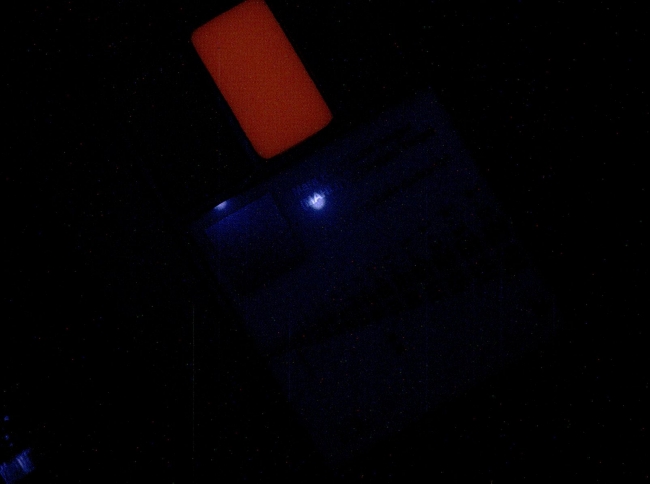 First Night Image of MAHLI Calibration Target Under Ultraviolet Lights, This image of a calibration target illuminated by ultraviolet LEDs (light emitting diodes) is part of the first set of nighttime images taken by the Mars Han...