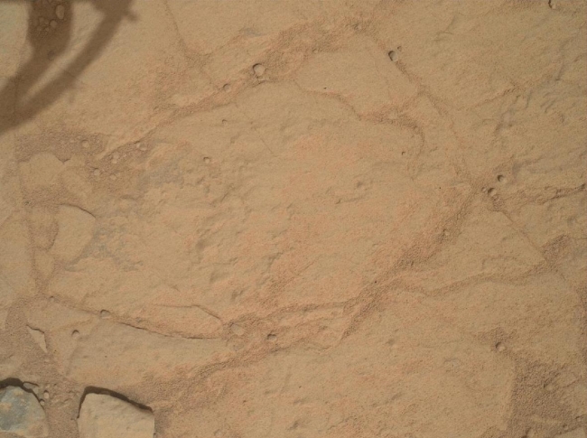 Before and After a Little Dusting, This set of images from NASA's Curiosity rover shows a patch of rock before and after it was cleaned by Curiosity's Dust Removal Tool (DRT). The images, obta...