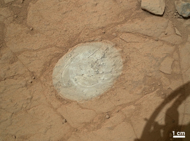 First Use of Mars Rover Curiosity's Dust Removal Tool, This image from the Mars Hand Lens Imager (MAHLI) on NASA's Mars rover Curiosity shows the patch of rock cleaned by the first use of the rover's Dust Removal...