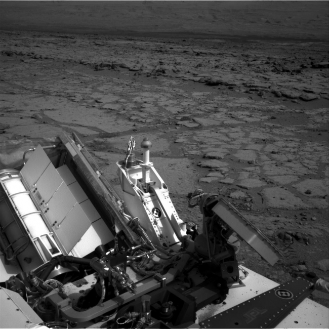 Looking Back at Entry Into 'Yellowknife Bay', The NASA Mars rover Curiosity used its left Navigation Camera to record this view of the step down into a shallow depression called "Yellowknife Bay." It too...