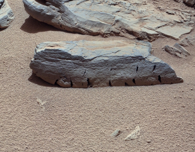 A Martian Rock Called 'Rocknest 3', Figure 1 Figure 2 Click on an individual image for larger views This view of a Martian rock called "Rocknest 3" combines four images taken by the right-eye c...