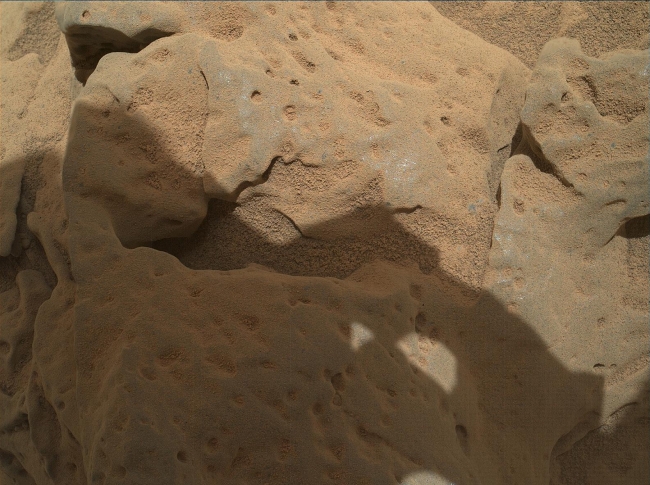 Rock 'Burwash' Near Curiosity, Sol 82, This focus-merge image from the Mars Hand Lens Imager (MAHLI) on the arm of NASA's Mars rover Curiosity shows a rock called "Burwash." The rock has a coating...