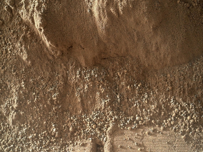 High-Resolution View of Cross-Section Through a Mars Ripple, This image shows the wall of a scuffmark NASA's Curiosity made in a windblown ripple of Martian sand with its wheel. The upper half of the image shows a smal...