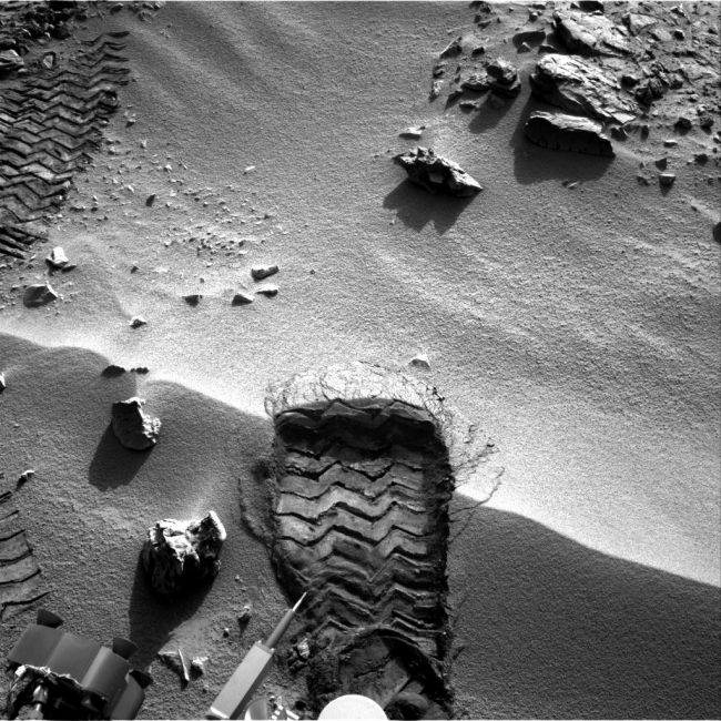 Wheel Scuff Mark at 'Rocknest', NASA's Mars rover Curiosity cut a wheel scuff mark into a wind-formed ripple at the "Rocknest" site to give researchers a better opportunity to examine the p...