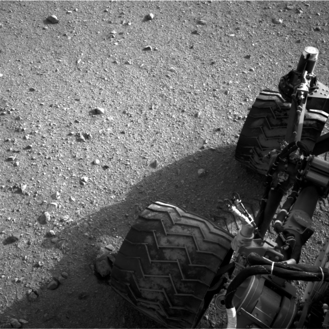 Martian Soil on Curiosity's Wheels After Sol 22 Drive, Soil clinging to the right middle and rear wheels of NASA's Mars rover Curiosity can be seen in this image taken by the Curiosity's Navigation Camera after t...