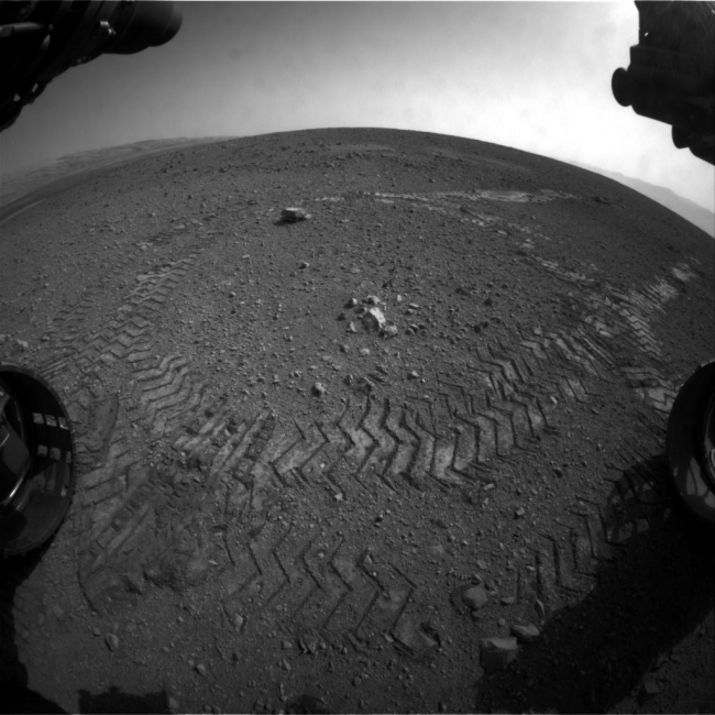Making Tracks on Mars, This image shows the tracks left by NASA's Curiosity rover on Aug. 22, 2012, as it completed its first test drive on Mars. The rover went forward 15 feet (4....