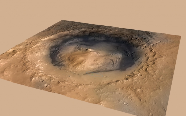 Curiosity Cradled by Gale Crater, NASA's Curiosity rover landed in the Martian crater known as Gale Crater, which is approximately the size of Connecticut and Rhode Island combined. A green d...