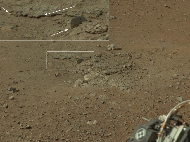 Exposed by Rocket Engine Blasts,  Figure 1 Click on the image for larger view This color image from NASA's Curiosity rover shows an area excavated by the blast of the Mars Science Laboratory...