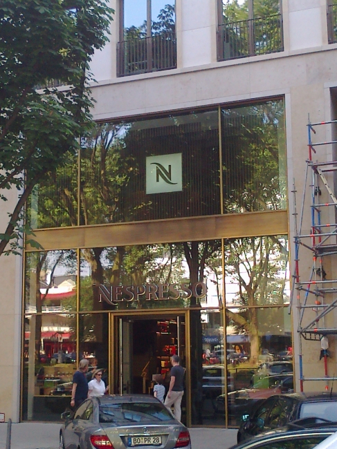 Nespresso store by Nestlé, on Düsseldorf's Königsallee, City, people go there to buy coffee in small capsules...