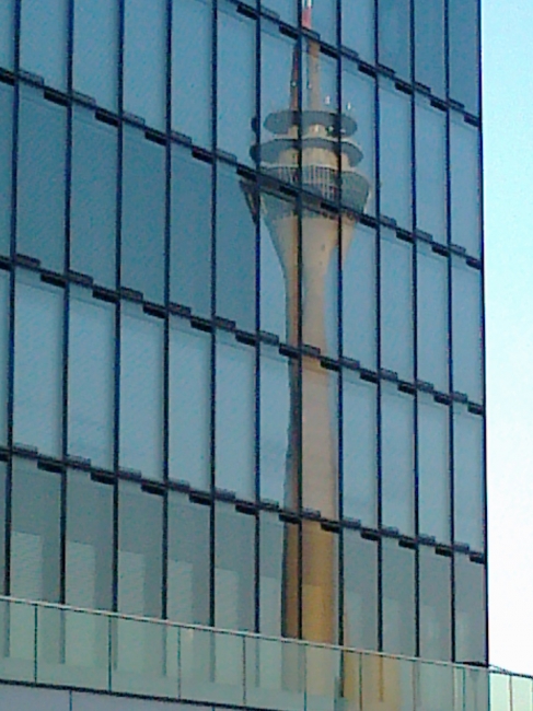 Funkturm mirrored in the fascade of the Grand Hyatt Düsseldorf, 