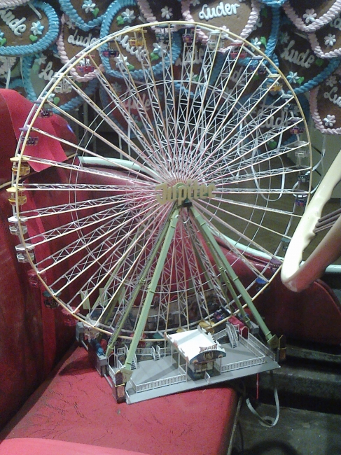 A ferris wheel, as put into an Auto-Scooter cart, as window decoration