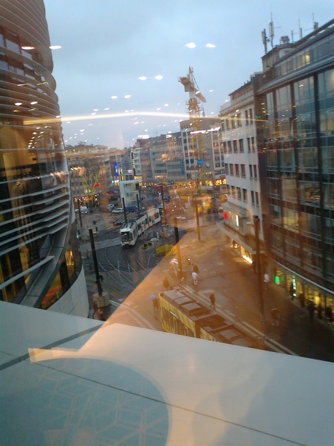 Former site of "Tausendfüßler", as seen from the top floor of "Kö-Bogen", looking down Shadowstraße; to the right a number of city office spaces that have seen hard times in the past and ar...