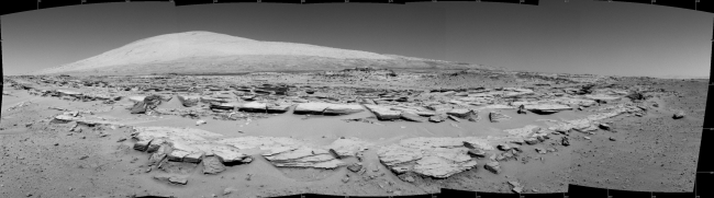 Martian Landscape with Rock Rows and Mount Sharp, This landscape scene photographed by NASA's Curiosity Mars rover shows rows of rocks in the foreground and Mount Sharp on the horizon. Curiosity's Navigation...