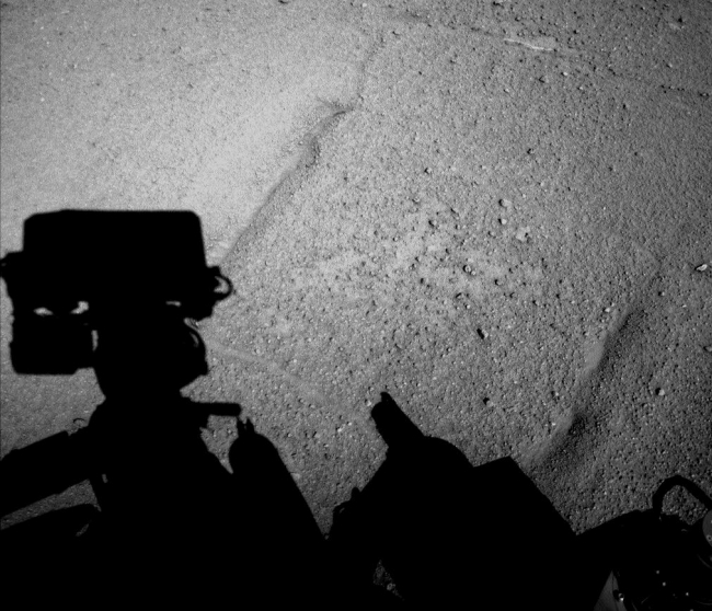 Curiosity Mars Rover's Shadow After Long Backward Drive, NASA's Curiosity Mars rover caught its own shadow in this image taken just after completing a drive of 329 feet (100.3 meters) on the 547th Martian day, or s...