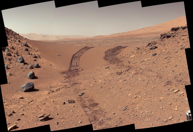 Curiosity's Color View of Martian Dune After Crossing It, Figure 1 Click on the image for larger version This look back at a dune that NASA's Curiosity Mars rover drove across was taken by the rover's Mast Camera (M...