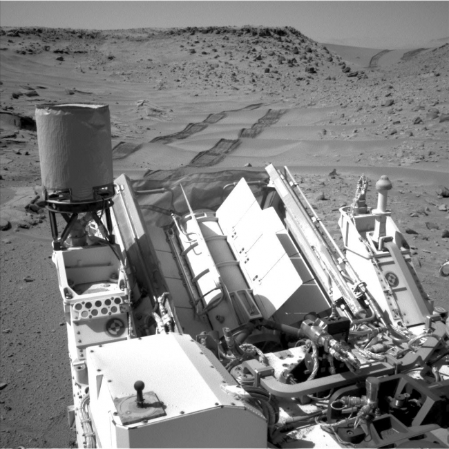 Curiosity Making Headway West of 'Dingo Gap', NASA's Curiosity Mars rover used the Navigation Camera (Navcam) on its mast to catch this look-back eastward at wheel tracks from driving through and past "D...