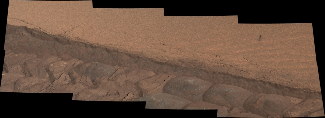 Ripple's Interior Exposed by Rover Wheel Track, Figure 1 Click on the image for larger version A wheel track cuts through a windblown ripple of dusty sand in this image from the Mast Camera (Mastcam) on NA...