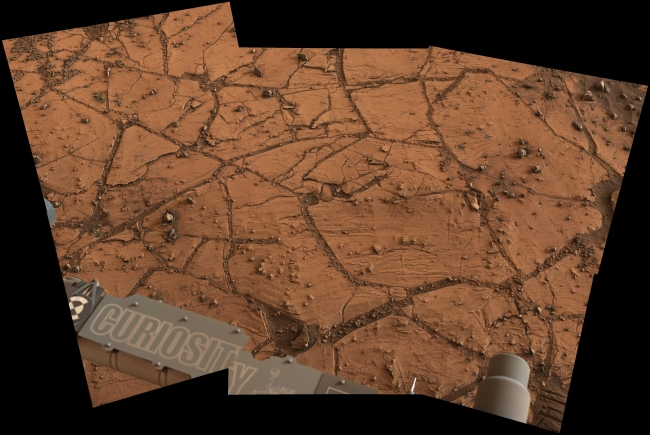 Fine-Grained, Finely Layered Rock at Base of Martian Mount Sharp, Figure 1 Click on the image for larger version This patch of Martian bedrock, about 2 feet (70 centimeters) across, is finely layered rock with some pea-size...