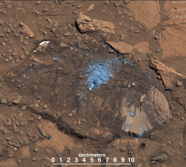 Loose Rock Leads to Incomplete Drilling, The "Bonanza King" rock on Mars, pictured here, was tapped by the drill belonging to NASA's Mars rover Curiosity. The tapping resulted in sand piling up on t...
