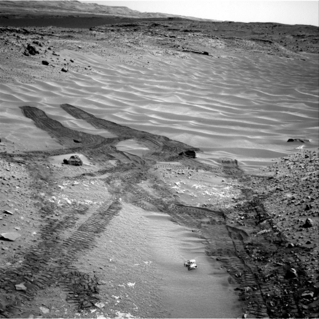 Down Northeastern Ramp into 'Hidden Valley' on Mars, This image from NASA's Curiosity Mars rover looks down the ramp at the northeastern end of "Hidden Valley" and across the sandy-floored valley to lower slope...