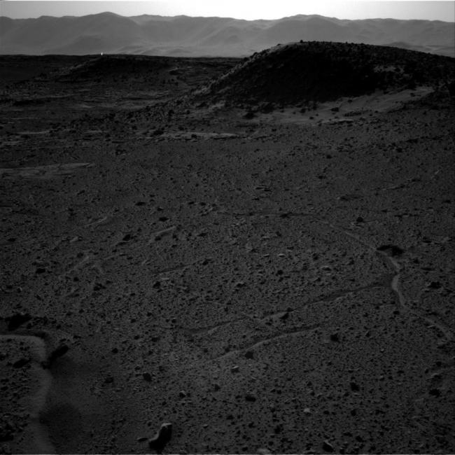 Bright Spot Toward Sun in Image from NASA's Curiosity Mars Rover, This image from the Navigation Camera (Navcam) on NASA's Curiosity Mars rover includes a bright spot near the upper left corner. The sun is in the same direc...