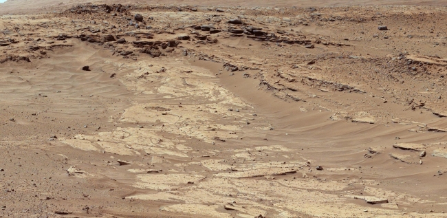Differential Erosion at Work on Martian Sandstones, Figure A Figure B Click on an individual image for full resolution figures image Sandstone layers with varying resistance to erosion are evident in this Mart...