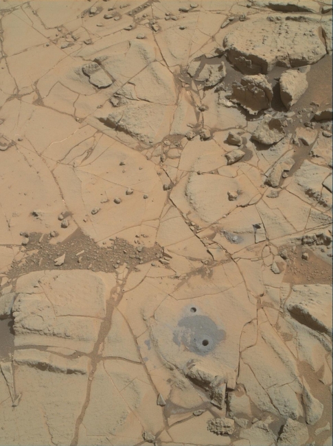 Site of Curiosity's Second Bite of Mount Sharp,  Gray cuttings from drilling by NASA's Curiosity Mars rover into a target called "Mojave 2" are visible surrounding the sample-collection hole in this image ...