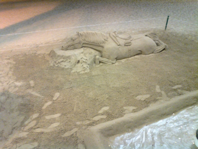 Dead?, or sleeping horse, sand sculpture on Levante beach