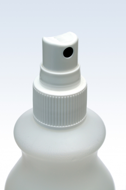 White medical spray-head close-up, A white medical spray-cap / spray-head and the upper part of the liquid bottle it belongs to. Typical bottle of a hygiene, disinfectant spray found in hospit...