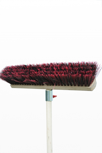 Isolated stiff-bristled besom, red, Upside-down, downside-up besom in front of white background, half of the broomstick in picture, red bristles