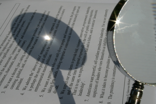 A magnifying glass focusing the sun on a piece of paper, 