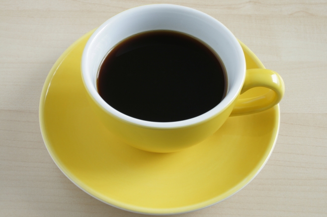 Yellow cup of coffee on wooden table, Yellow cup of coffee on wooden table, cup in close up