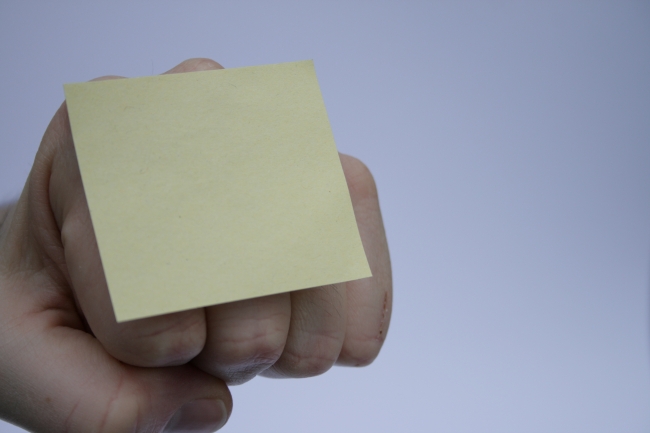 Blank Post-it note on fist, 