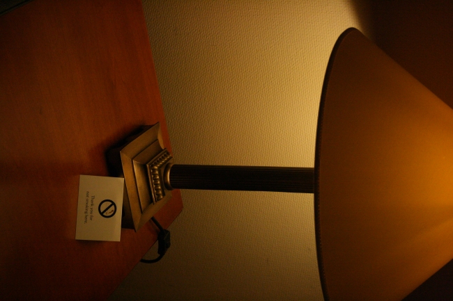Desk lamp, A hotel desk lamp at night, with a sign saying "No Smoking"