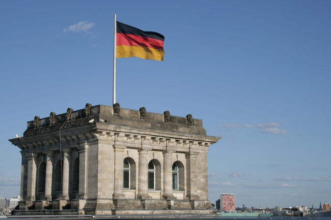 Corner tower of the Berlin Reichstag, with the German flag, photographed on the roof of the building