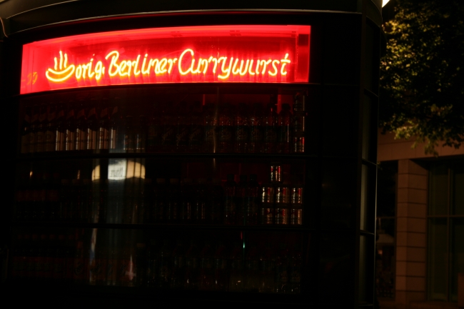 Berliner Currywurst, Neon sign of a small shop, at night