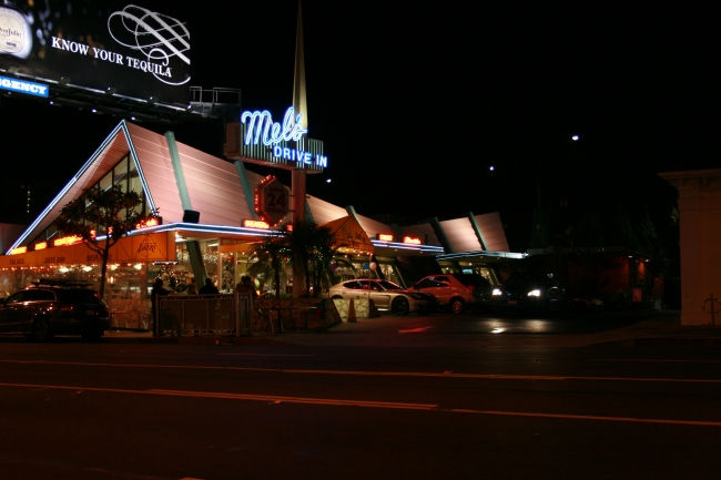 Mel's Drive In on sunset with their valet parking to the right, and a "Know your Tequila" billboard above