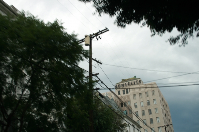 The Montecito Apartments building and power lines, a bit blurred, on 6650 Franklin Ave #101, Los Angeles