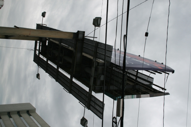 One of the giant billboards entangled in power lines, 